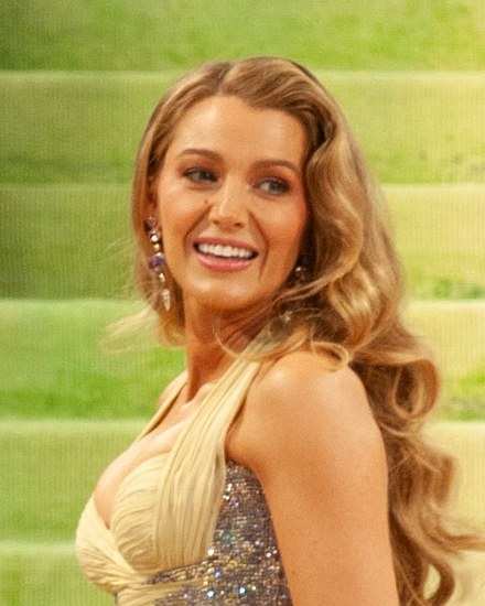 Blake Lively smiling on the steps at the 2026 Met Gala