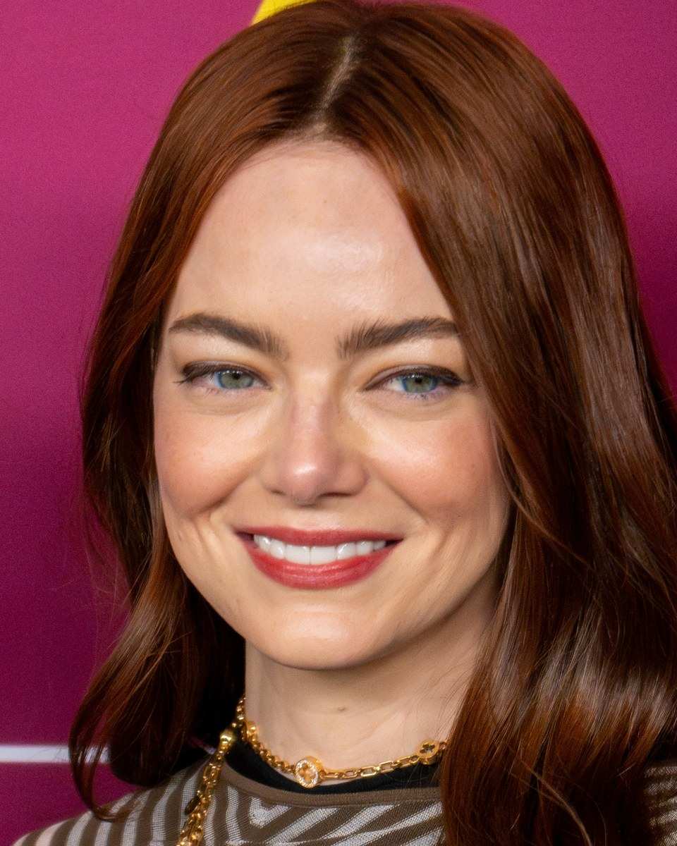 Emma Stone smiling at the New York Film Festival in 2024