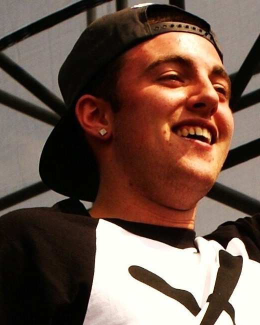 Mac Miller laughing on stage at Governors Ball in 2011
