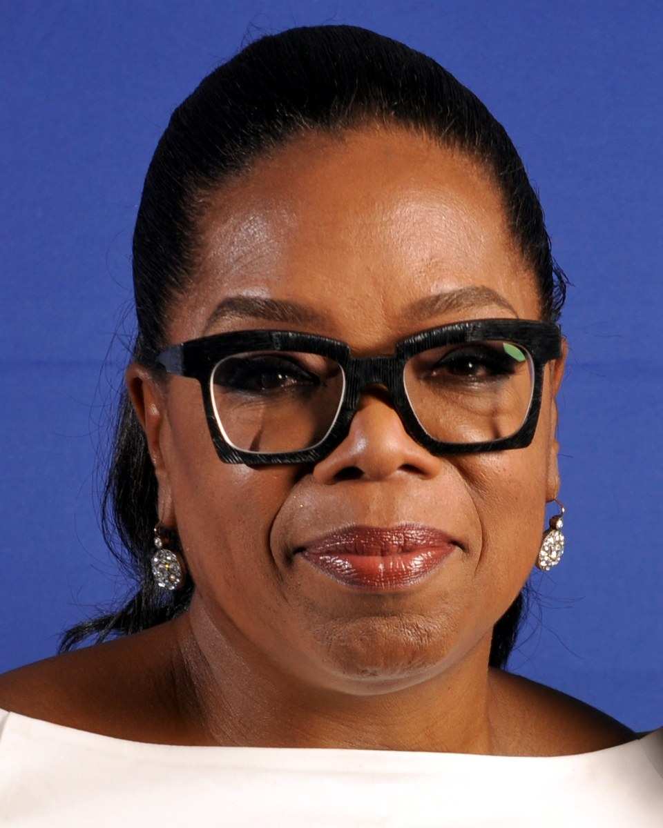 Oprah Winfrey in glasses and a white top in 2016