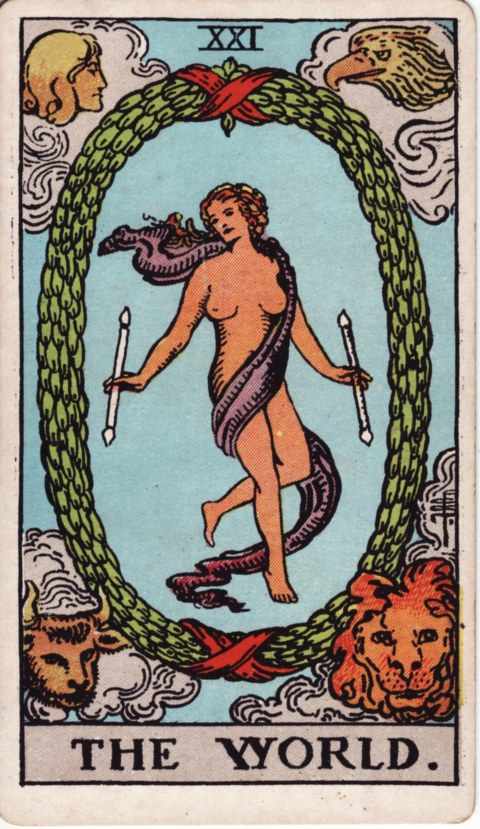 The World card of the Rider–Waite–Smith deck: a dancing figure wrapped in a purple sash holds a wand in each hand inside a large oval laurel wreath tied with red ribbons, with a human head, an eagle, a bull and a lion in the four corners among clouds